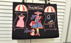 JUST IN TIME FOR MOTHER'S DAY!!!!&nbsp; Cute, sassy St. John's&nbsp;Bay&nbsp;bag.&nbsp; Large enough to hold all of your accessories.&nbsp; Gently used.&nbsp; Will defiently be an
attention grabber!!! Has several compartments to hold glasses, keys,