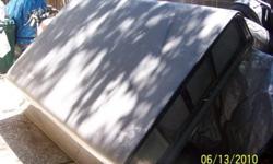 Monterey Fiberglass Camper Shell .
Custom for small '89 Toyota Truck.
Color Grey. Back door glass is tented.
Shell has front sliding glass doors for cab entry. Back glass door has locks.
No structural damage. Needs touch-up or re-paint to match your