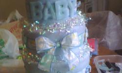 Baby Shower Gifts
Diaper Cakes
Pick your own themes, colors, styles and accessories. You can also purchase your own items to be
used on cakes for a really personal touch. Cakes may be 2-4 Tiers with as many accessories as you want.
Styles - Themes