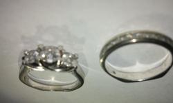 Helzberg Jewelry wedding set, original price was $1600 for both but asking for $600 for both or $400 for an individual ring. Bought in 2012,
white gold, the wedding band is 10k (and is inscribed with "10k" on the inside of the ring), and the engagement
