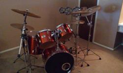 Full set of Yamaha Drums made in the 50s. Sunburst Orange with Zildjan cymbals and a set of tri toms. Fairly new Remo drum heads, and double bass pedal and cowbells.