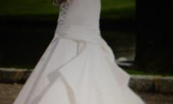 Designer brand name silk satin strapless mermaid style wedding gown
Original cost over $2500 Fits approx street size 8-10