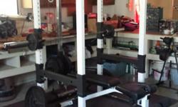 Weider Body Weight Cage and Bench. Adjustable-Weight Curling Bar, Pull-up Bar, Barbell rack. Excellent condition. Barbells, weights also available.