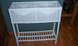 White Wicker Plant Stand. 26L 27H 9 wide Used inside for artifical ferns. Shelf on botton. Very good condition. Non smoking home. $40 cash only. Phone 417-724-1247