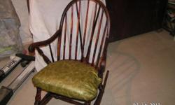 Old Windsor rocking chair. refinished wood. Was caned seat-now vinyl covered seat. $35. Call 256 355-2226