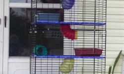 Tall wire cage hass white floors and sliding tubes,
Red bed on top floor, water bottle ,
cage is pet ready, similar to caghe in pic excet
where the pic has blue floor my cvage has white