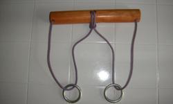 Can you get one of the rings onto the loop of string with the other ring? No tools, cutting, breaking, smashing, or prying required.
3.5 feet of 1/4 inch light purple rope. (8) inches of 1 1/4 inch wood dowel. (2) 1 1/2 inch galvanized steel rings. Hand