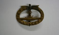 I am selling my WWII German Kriegsmarine Frank & Reif Stuttart U-boat War Badge. The gilding is in beautiful shape with slit discolor to the chest of the eagle. . I do not agree with racism or fascism and I will not tolerate those who do. You may contact