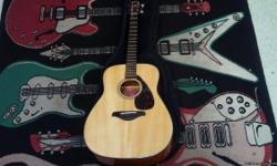 This acoustic guitar is from Yamaha, the FG700S. It plays well, the sound resonating loudly from the shell. In a public performance it will perform wonderfully. The Model FG700S has an all-American acoustic look, and this one is only slightly used, with